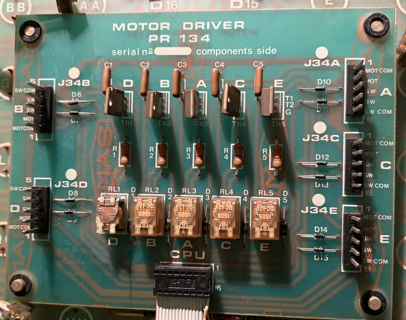 The PR134 motor driver board, with five relays along the bottom and five triacs along the top